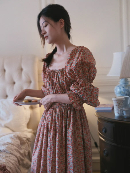 woman wearing red floral cottagecore dress with puff sleeves, soft romantic indoor lighting