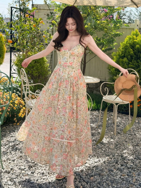 Sleeveless floral print long dress with fitted bodice and flowing skirt, elegant garden party dress