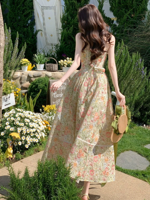 Back view of floral print maxi dress with tie detail, feminine summer garden dress