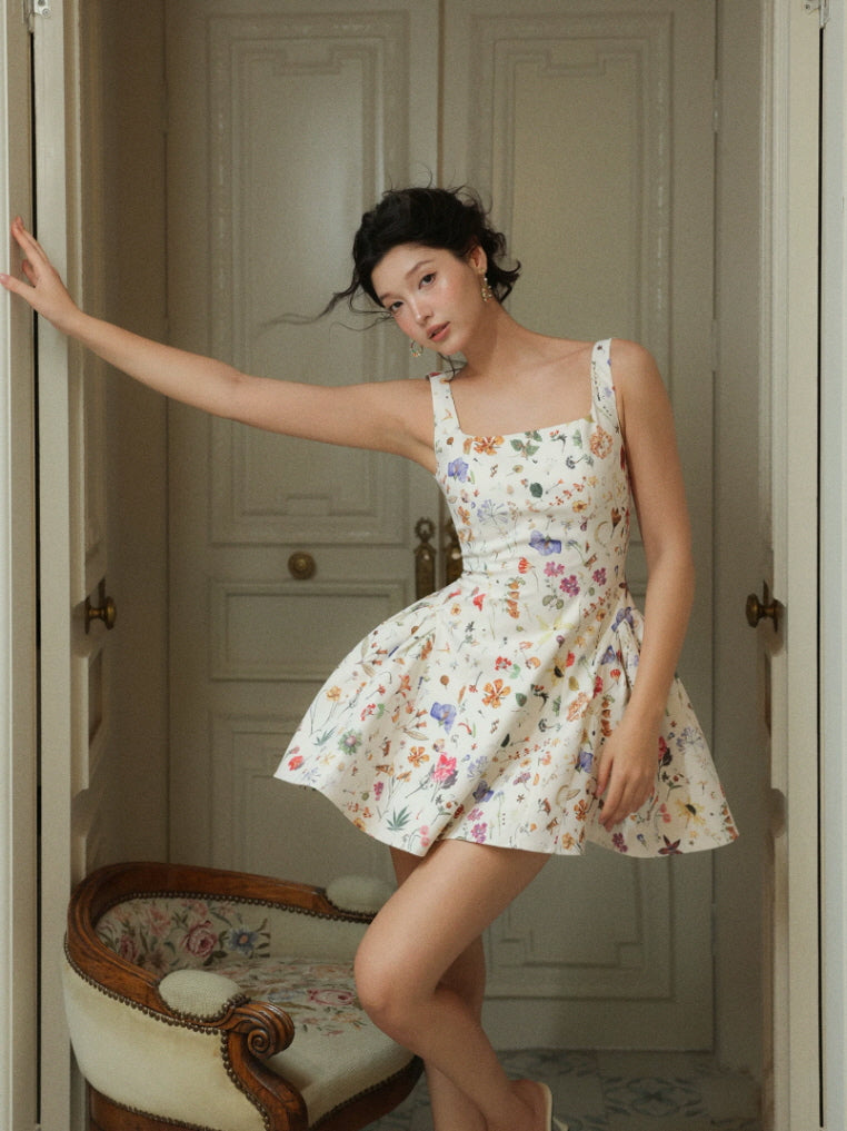 Botanical garden print fairycore mini dress with flared skirt and square neckline, styled in a vintage doorway
