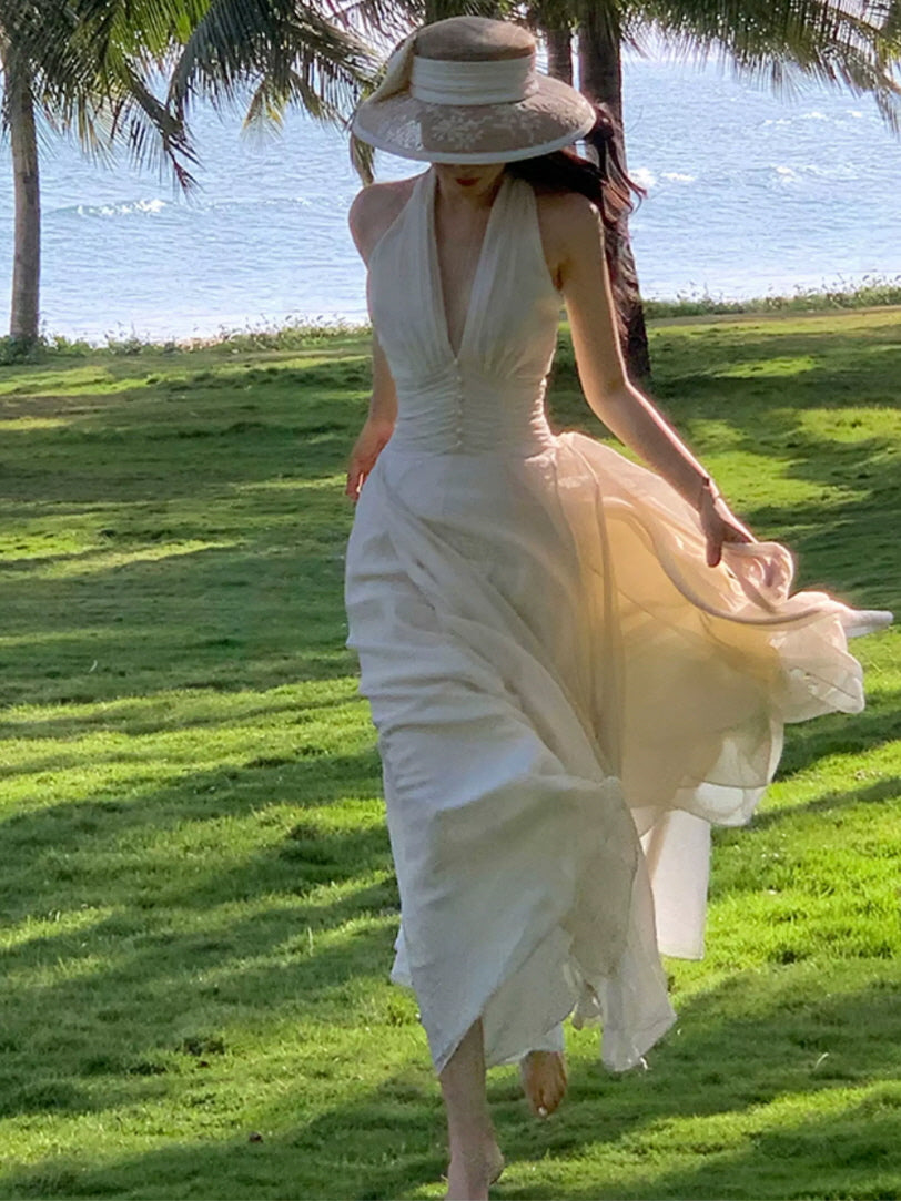 Ivory halter vacation fairycore dress with airy sheer skirt and romantic beachside styling