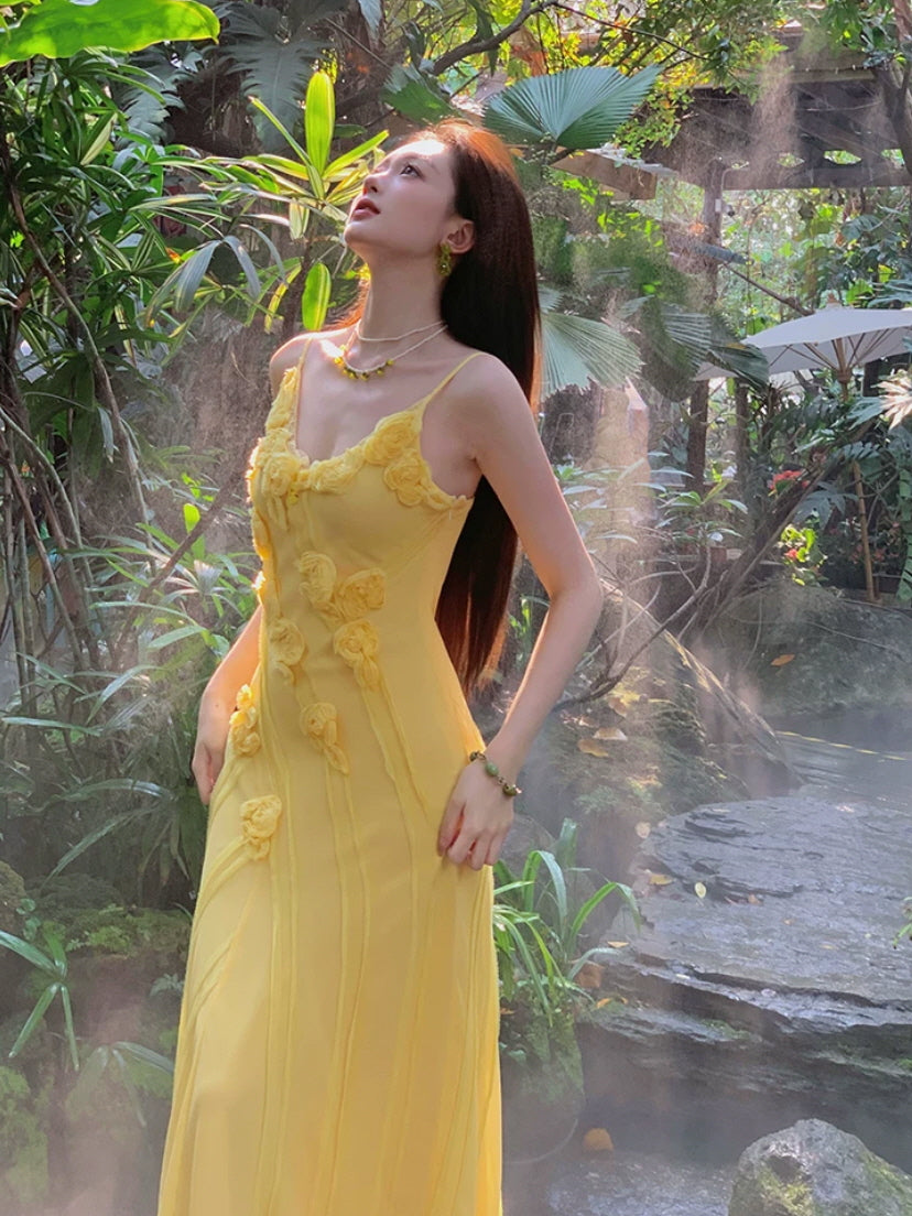 Romantic yellow maxi dress with floral appliques and delicate spaghetti straps