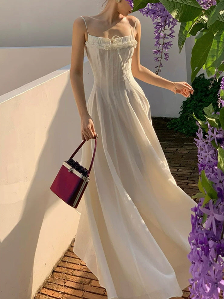 Romantic ivory fairycore maxi dress with delicate floral trim and dreamy cottagecore styling