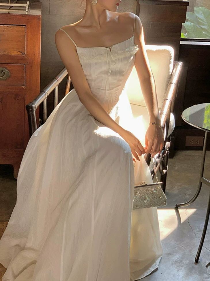 Romantic ivory fairycore dress with soft textured fabric and flowing cottagecore silhouette