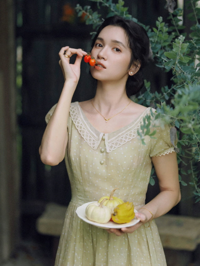 Vintage sage green dotted dress with delicate lace collar and pearl buttons