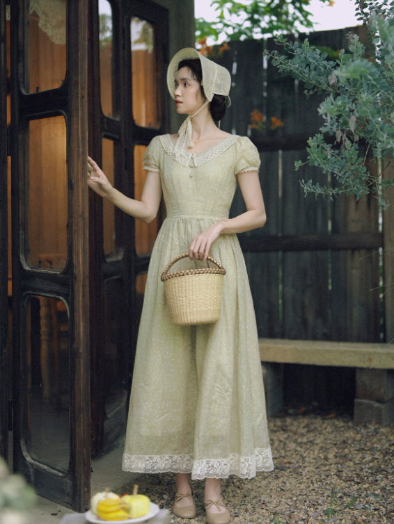 Sage green lace trim midi dress styled with bonnet and wicker basket