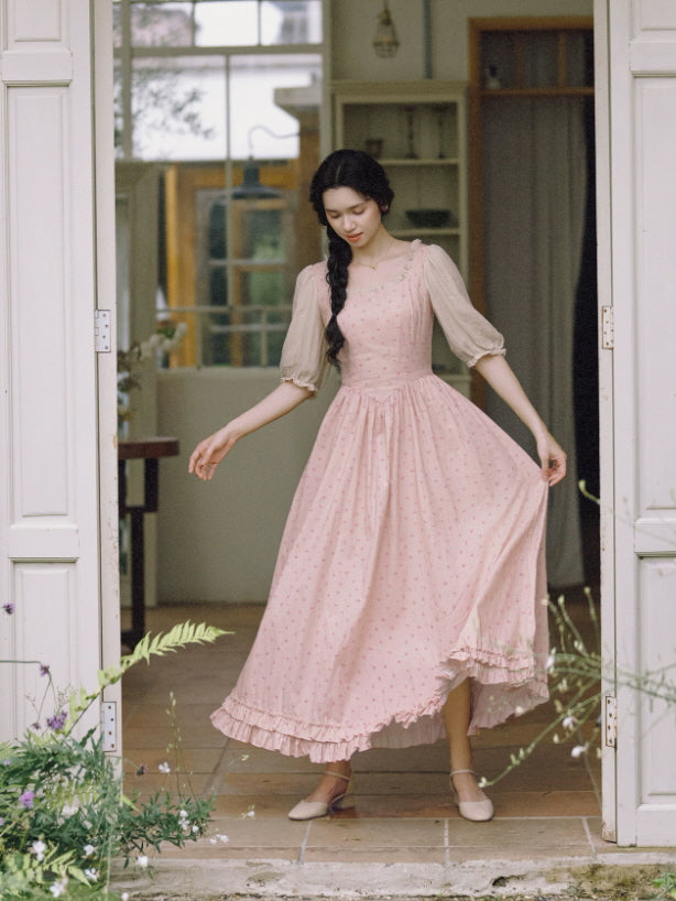Pink floral cottagecore maxi dress with puff sleeves and ruffled hem