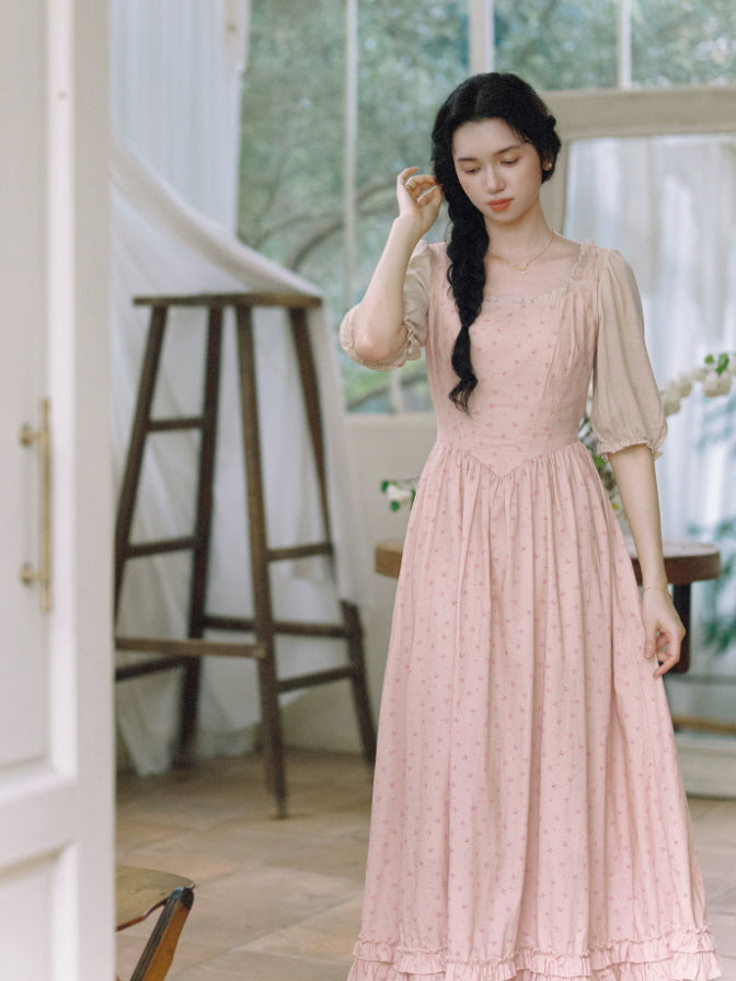 Romantic prairie cottagecore maxi dress in soft pink with gathered skirt and puff sleeves