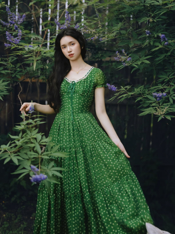 Green floral prairie maxi dress with tiered skirt in a blooming garden