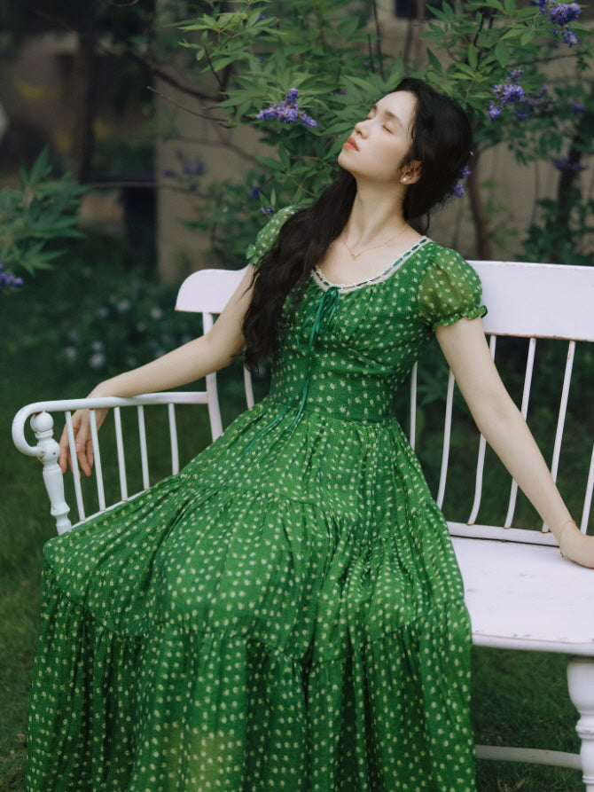 Romantic cottagecore green dress with lace trim and flowing full-length skirt