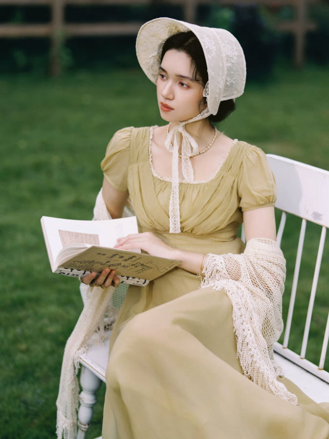 Regency inspired olive green dress with romantic puff sleeves and empire waist styled with a lace bonnet and shawl
