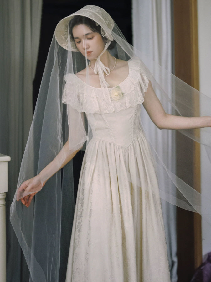 Vintage inspired ivory lace dress with corset style bodice, romantic ruffle neckline and flowing maxi skirt