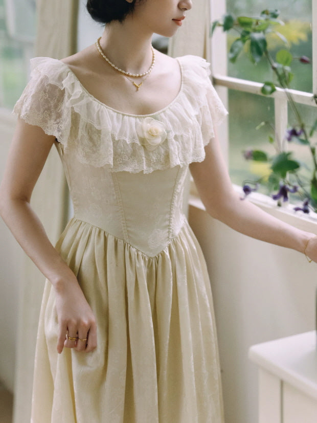 Romantic ivory princesscore dress with lace flutter sleeves, floral bodice detail and gathered vintage skirt