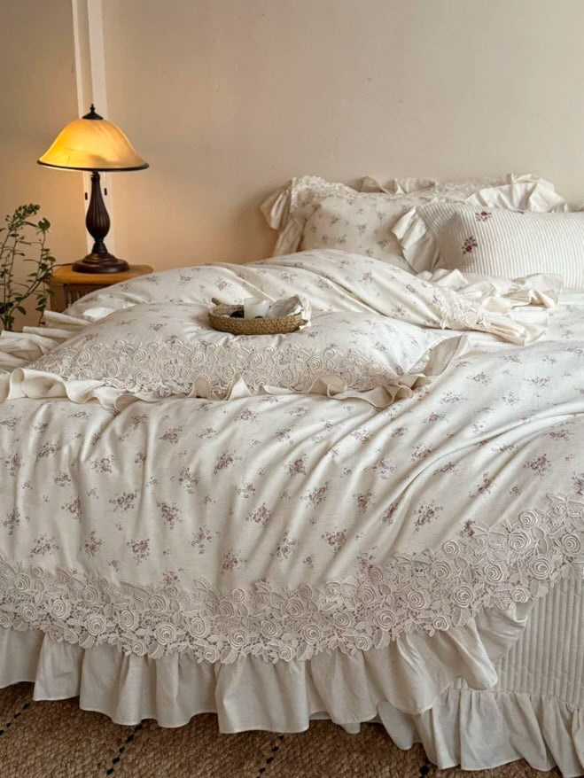Romantic vintage bedding set with subtle floral print, rose lace detailing, and elegant ruffles for a soft cottagecore aesthetic