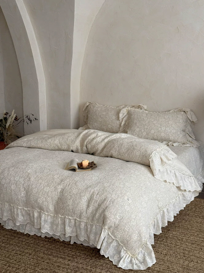 Ivory floral ruffle bedding set with layered lace trim in a romantic cottagecore bedroom