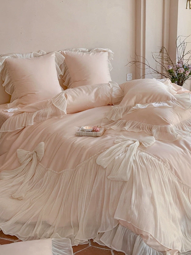 Blush pink cottagecore bedding set styled with soft ruffles and vintage-inspired bow details