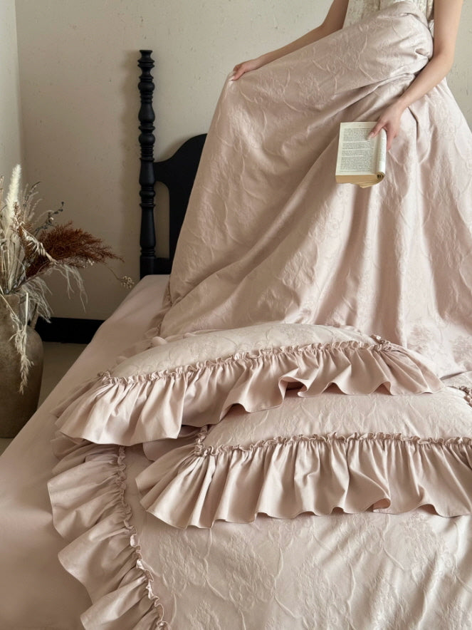 Elegant pink cottagecore bedding set with textured flowers and feminine ruffle accents