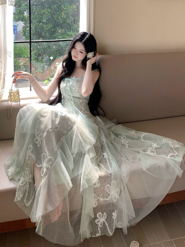 Dreamy sage green princesscore maxi dress with embroidered lace bows and soft flowing tulle layers
