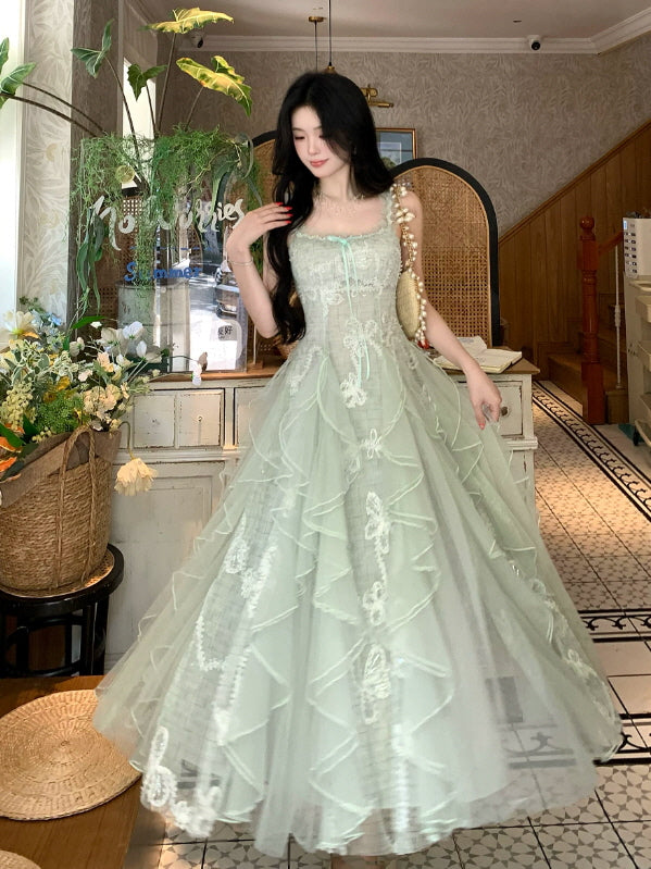 Romantic mint green fairycore gown with fitted lace bodice, cascading ruffles and vintage inspired tulle skirt
