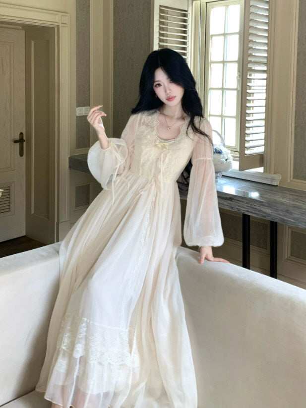 Romantic ivory cottagecore nightgown with long sheer sleeves, lace bodice and flowing maxi silhouette