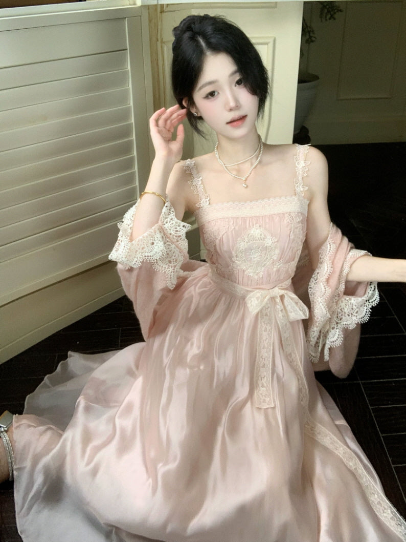 Vintage inspired pink lace dress with embroidered bodice, flowing satin skirt and delicate ribbon belt
