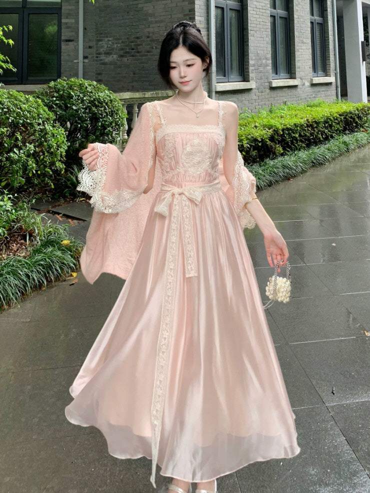 Elegant blush pink fairycore dress with lace straps, ribbon waist and flowing satin princess skirt