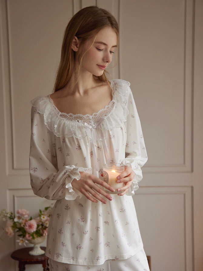 Ivory cottagecore pajama set with delicate rose print, lace ruffles and soft feminine loungewear design