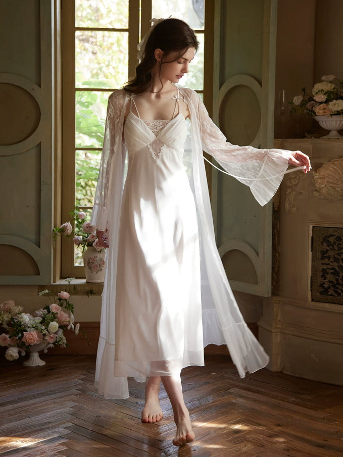 Elegant white lace nightgown with bow shoulder straps and flowing maxi silhouette