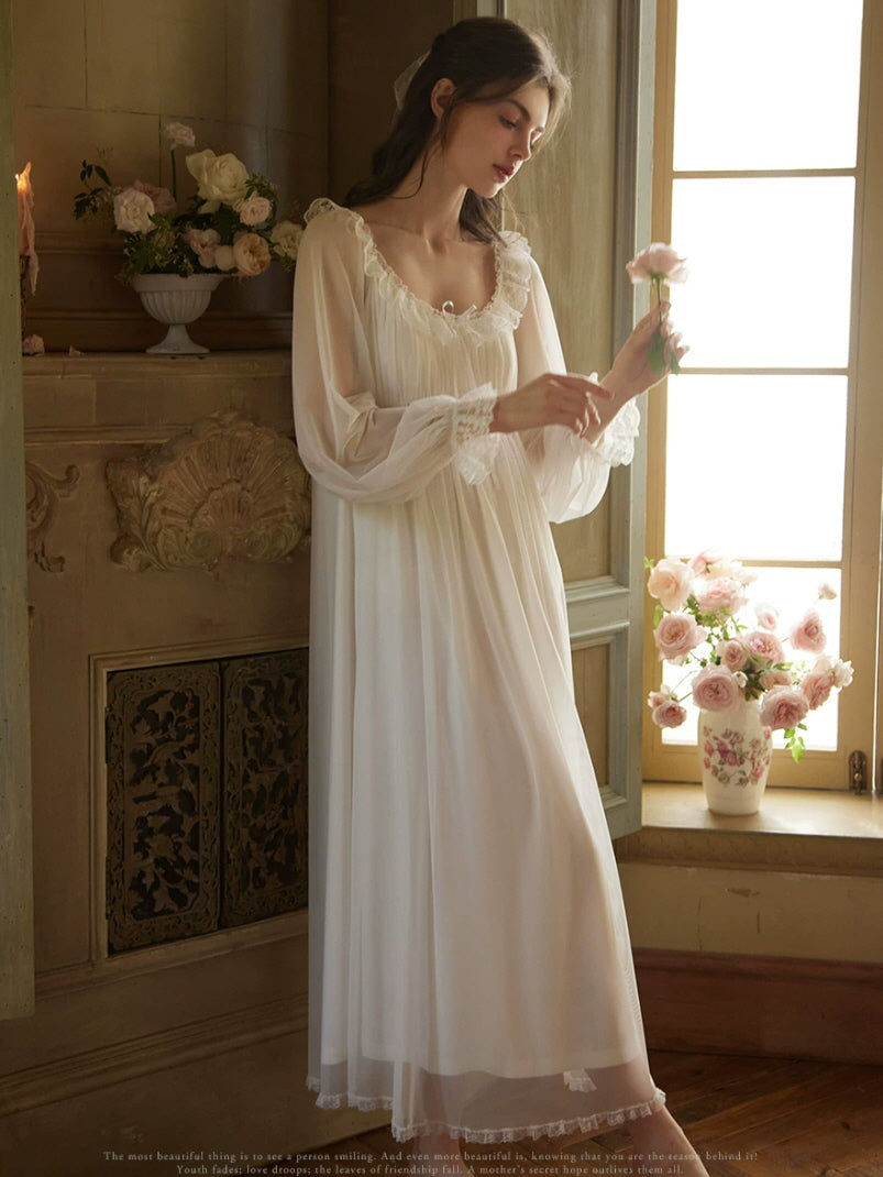 Romantic white nightgown with lace trim, flowing maxi skirt and sheer sleeves, cottagecore sleepwear