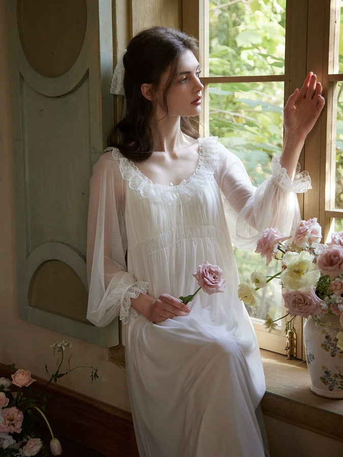 Dreamy white lace nightgown with long sheer sleeves and flowing silhouette, romantic feminine sleepwear