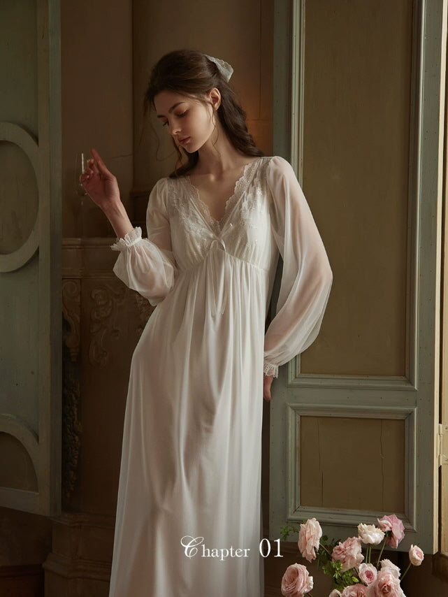 Elegant white long sleeve nightgown with lace neckline and soft flowing maxi silhouette