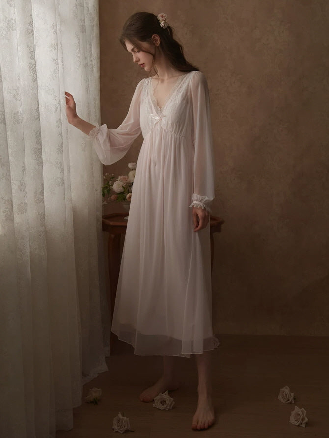 Vintage white nightgown with sheer puff sleeves, lace trim and flowing cottagecore silhouette