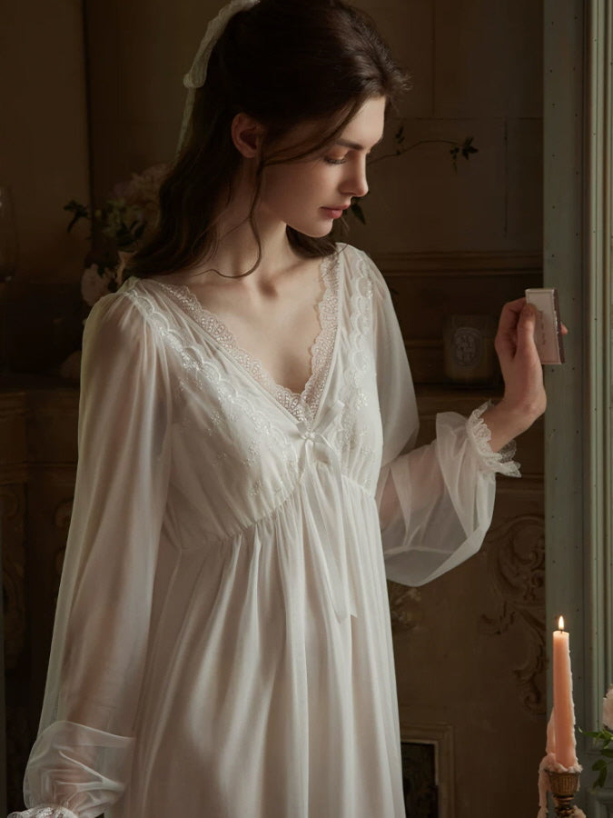 Romantic white nightgown with embroidered lace bodice, bow detail and sheer sleeves