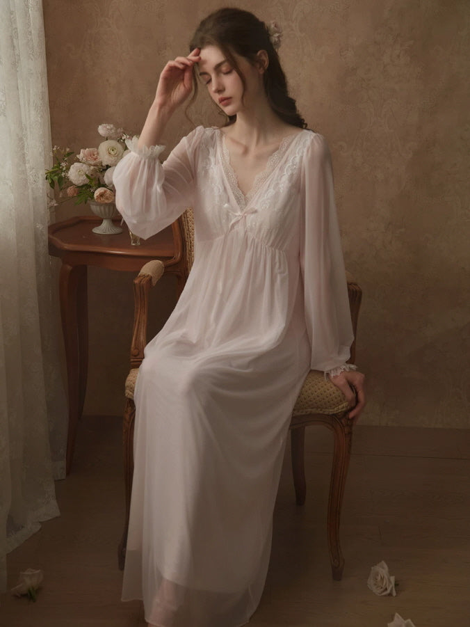 White romantic nightgown with embroidered lace neckline, sheer sleeves and feminine bow detail