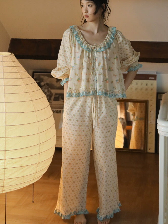 Two piece floral cotton pajama set with ruffled blouse, puff sleeves and relaxed straight leg pants