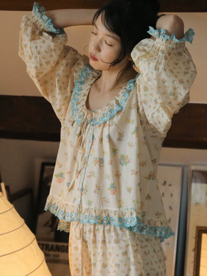 Vintage style cotton pajama set featuring tiny floral print, oversized sleeves and blue lace ruffle details