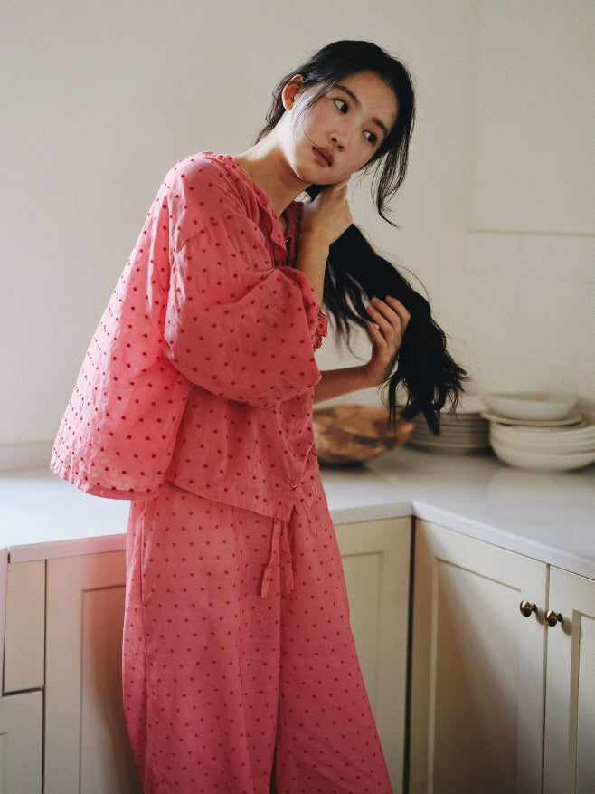 Two piece pink cotton sleepwear set with gathered blouse, drawstring waist pants and ruffled hems