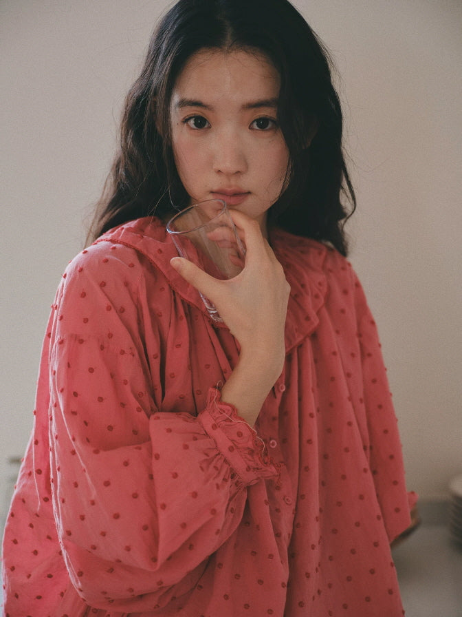 Pink cotton pajama set with ruffle collar, button front top and wide leg pants with frilled hems