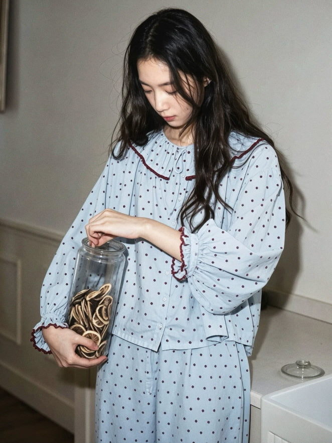 Light blue cotton pajama set with burgundy polka dots, ruffle collar and relaxed wide leg pants