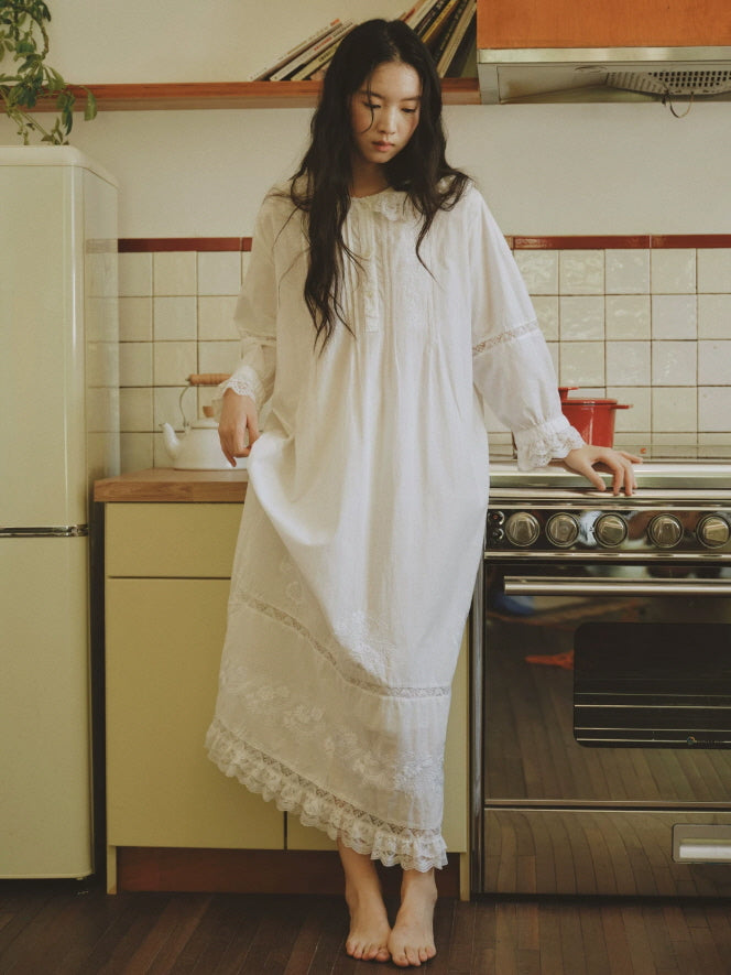 Classic white cotton nightgown with delicate embroidery, lace trimmed sleeves and romantic maxi length