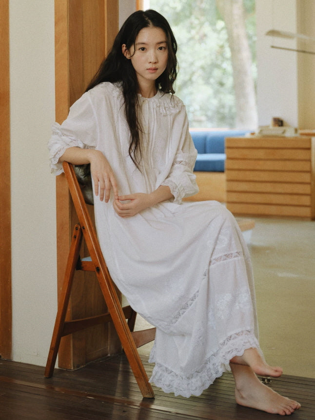 White cotton nightgown with lace trim, embroidered details and a flowing ankle length silhouette