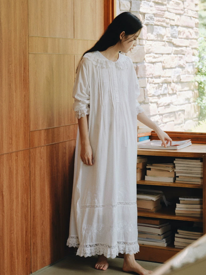 Long white cotton sleep dress with delicate lace trim, embroidered hem and romantic loose fit