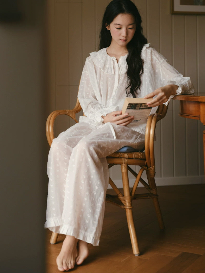 Romantic white sleepwear set with embroidered fabric, layered ruffle neckline and wide leg pants