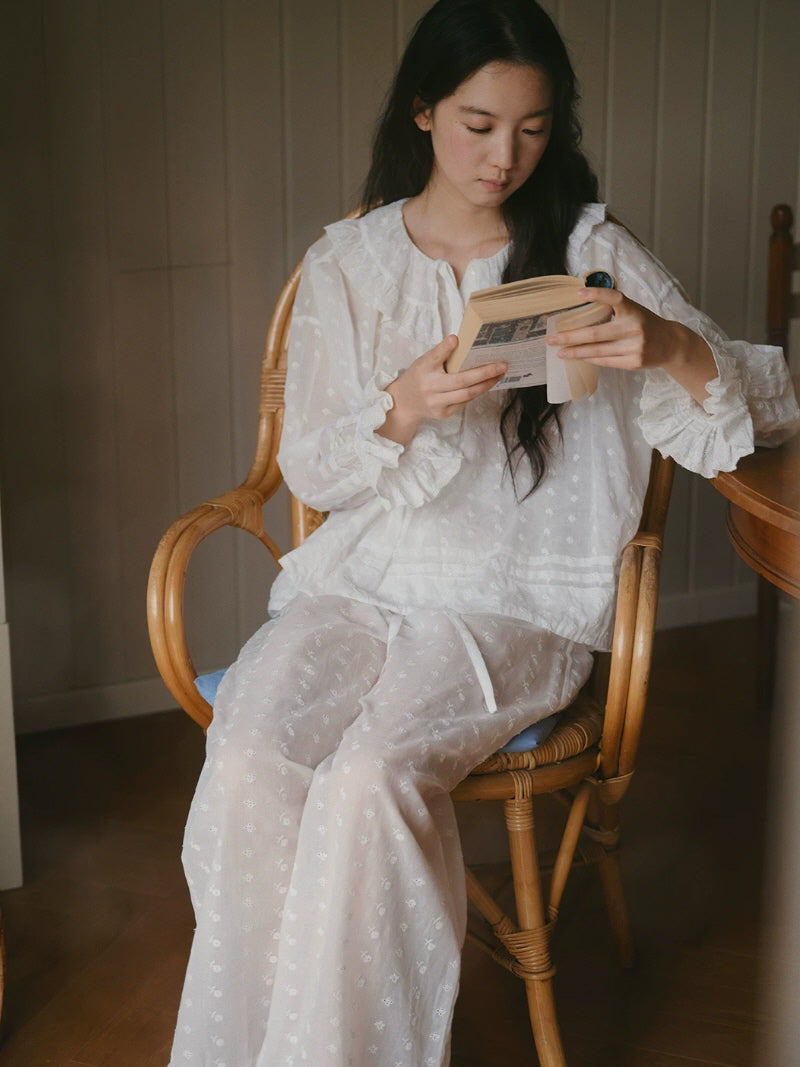 Vintage inspired white pajamas with delicate floral embroidery and feminine lace ruffle details