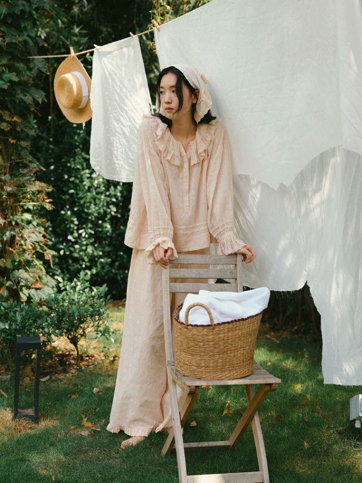 Blush pink vintage style pajamas with delicate eyelet embroidery and feminine ruffle trim