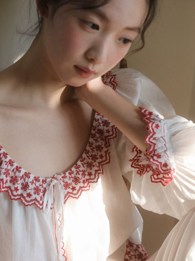 White embroidered pajama set with red lace details and relaxed fit for cozy indoor lounging