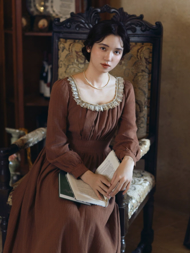 Vintage style brown dress with square neck, lace ruffle detail and softly pleated bodice