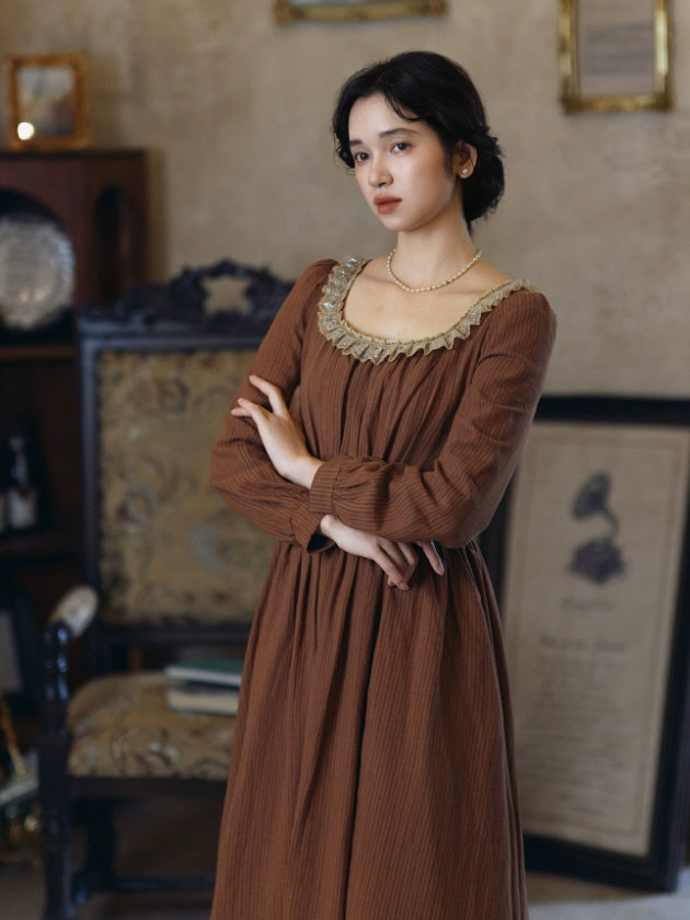 Romantic brown maxi dress with fitted waist, gathered bodice and delicate vintage lace details