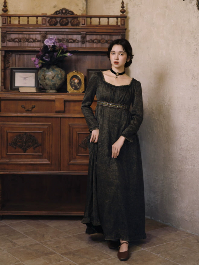 Full-length dark vintage-inspired dress with flowing skirt, square neckline and decorative waist trim