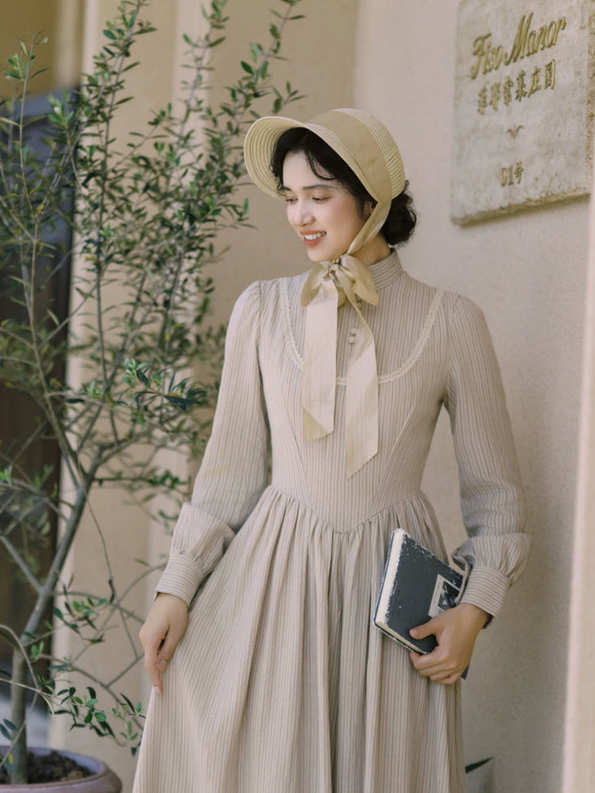 Women’s ivory striped cottagecore dress with high collar, button front and fitted vintage-inspired bodice